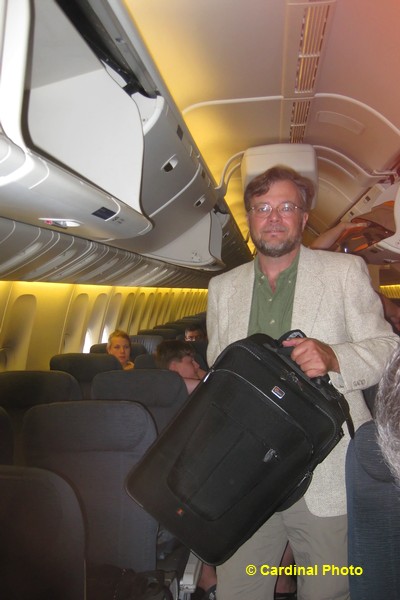 David puts the Lowepro X200 into an overhead compartment